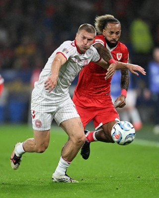 041026 - Wales v Denmark - UEFA Nations League - Sorba Thomas of Wales is challenged by Rasmus Kristensen of Denmark