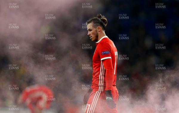 161118 - Wales v Denmark - UEFA Nations League B - Gareth Bale of Wales through the smoke from the flare