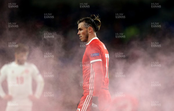 161118 - Wales v Denmark - UEFA Nations League B - Gareth Bale of Wales through the smoke from the flare