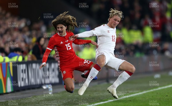 161118 - Wales v Denmark - UEFA Nations League B - Kasper Holberg of Denmark charges into Ethan Ampadu of Wales sending him into the advertising boards