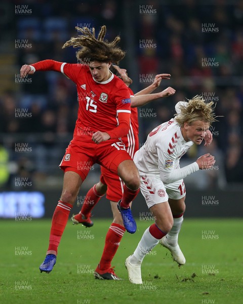 161118 - Wales v Denmark - UEFA Nations League B - Ethan Ampadu of Wales returns the favour to Kasper Holberg of Denmark a few minutes later, receiving a yellow card