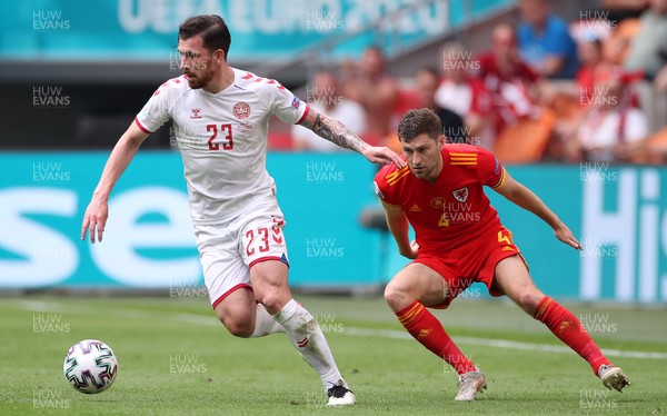 260621 - Wales v Denmark - European Championship - Round of 16 - Pierre-Emile Hojbjerg of Denmark is challenged by Ben Davies of Wales