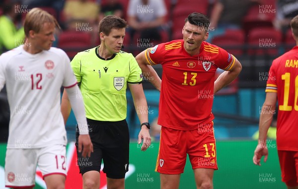 260621 - Wales v Denmark - European Championship - Round of 16 - Kieffer Moore of Wales is given a yellow card by the referee