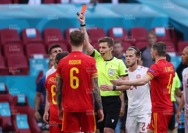 260621 - Wales v Denmark - European Championship - Round of 16 - Harry Wilson of Wales gets a red card from Referee Daniel Siebert