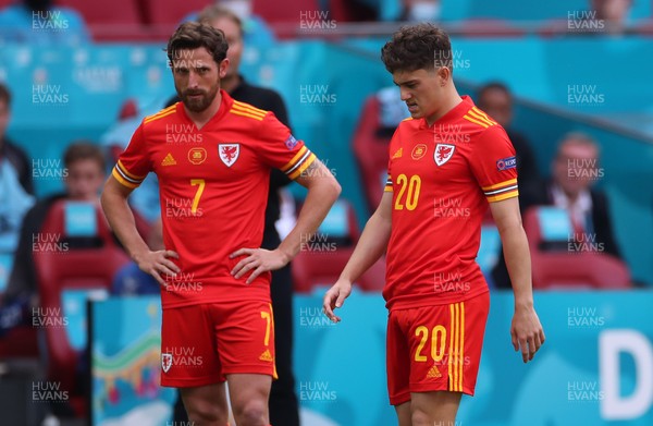 260621 - Wales v Denmark - European Championship - Round of 16 - A dejected Joe Allen and Dan James of Wales