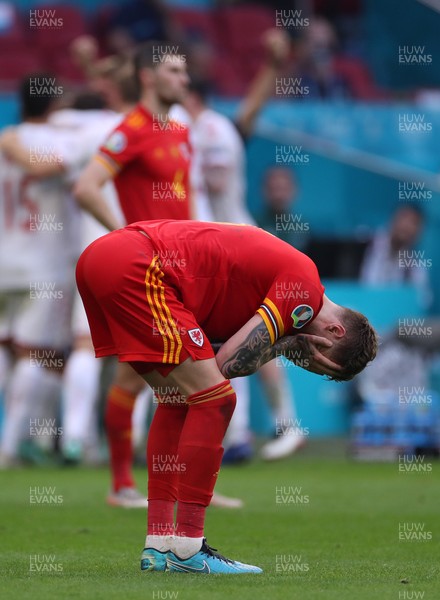 260621 - Wales v Denmark - European Championship - Round of 16 - Joe Rodon of Wales dejected at full time