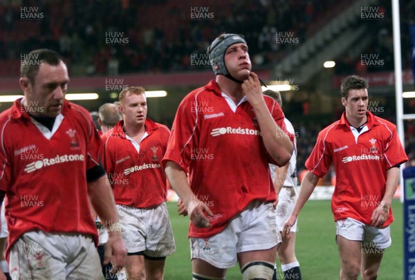 030201 - Wales v England - Six Nations - Wales players (l-r) Robin McBryde, Martyn Williams, Andy Moore and Mark Jones leave field at end of game