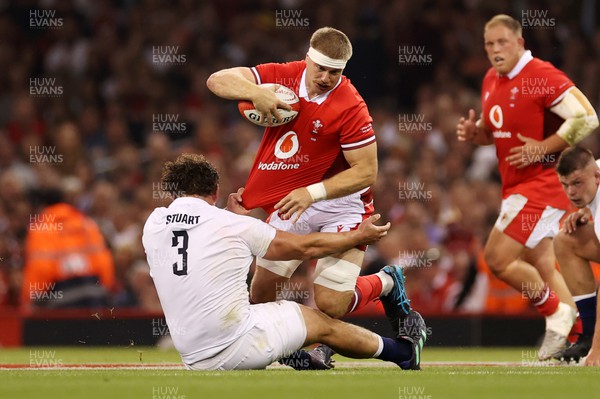 050823 - Wales v England - Vodafone Summer Series - Aaron Wainwright of Wales is tackled by Will Stuart of England 