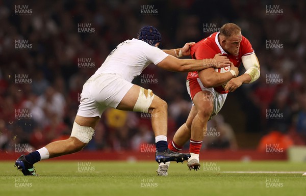 050823 - Wales v England - Vodafone Summer Series - Corey Domachowski of Wales is tackled by George Martin of England 