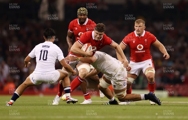 050823 - Wales v England - Vodafone Summer Series - Will Rowlands of Wales is tackled by George Martin of England 