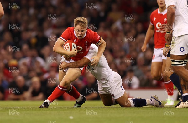 050823 - Wales v England - Vodafone Summer Series - Sam Costelow of Wales is tackled by Danny Care of England 