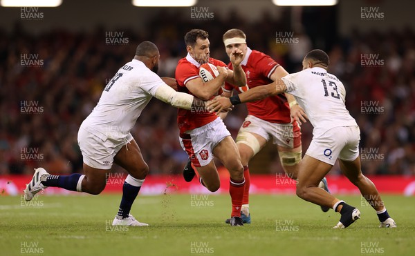 050823 - Wales v England - Vodafone Summer Series - Tomos Williams of Wales is tackled by Kyle Sinckler and Joe Marchant of England 