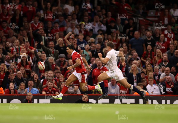 050823 - Wales v England - Vodafone Summer Series - Louis Rees-Zammit of Wales kicks the ball up field 