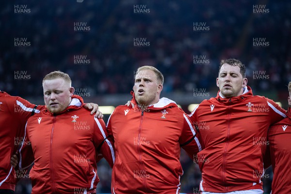 050823 - Wales v England - Vodafone Summer Series - Keiron Assiratti, Corey Domachowski and Ryan Elias of Wales sing the anthem