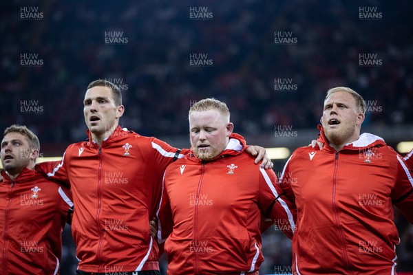 050823 - Wales v England - Vodafone Summer Series - George North, Keiron Assiratti and Corey Domachowski of Wales sing the anthem