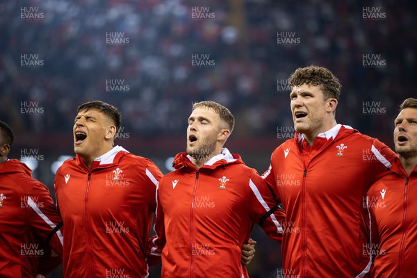 050823 - Wales v England - Vodafone Summer Series - Dafydd Jenkins, Max Llewellyn and Will Rowlands of Wales sing the anthem