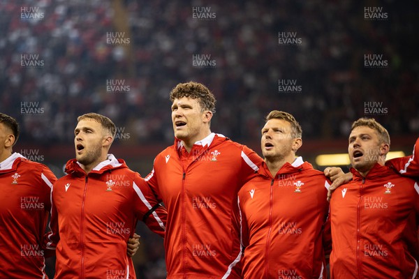 050823 - Wales v England - Vodafone Summer Series - Max Llewellyn, Will Rowlands, Dan Biggar and Leigh Halfpenny of Wales sing the anthem