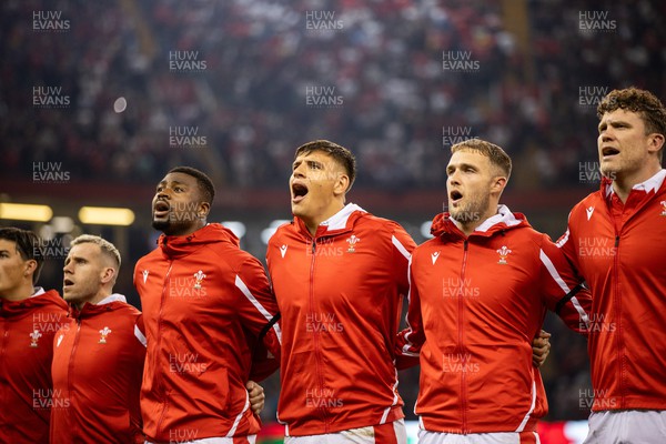 050823 - Wales v England - Vodafone Summer Series - Gareth Davies, Christ Tshiunza, Dafydd Jenkins, Max Llewellyn and Will Rowlands of Wales sing the anthem