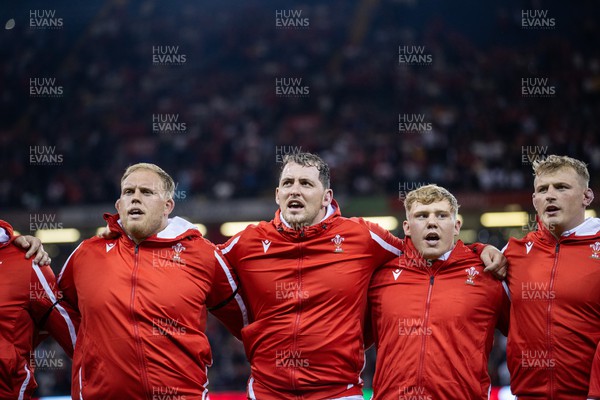 050823 - Wales v England - Vodafone Summer Series - Corey Domachowski, Ryan Elias, Sam Costelow and Jac Morgan of Wales sing the anthem