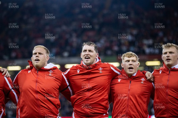 050823 - Wales v England - Vodafone Summer Series - Corey Domachowski, Ryan Elias, Sam Costelow and Jac Morgan of Wales sing the anthem