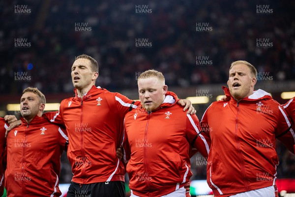 050823 - Wales v England - Vodafone Summer Series - Leigh Halfpenny, George North, Keiron Assiratti and Corey Domachowski of Wales sing the anthem