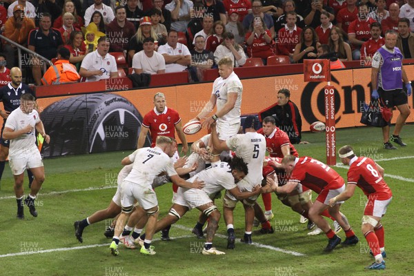 050823 - Wales v England - Summer Series - Forwards of Wales defend a lineout as David Ribbans of England takes 