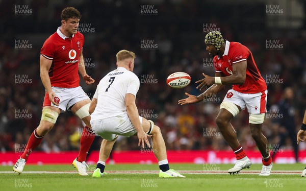 050823 - Wales v England, Vodafone Summer Series - Christ Tshiunza of Wales offloads to Will Rowlands of Wales