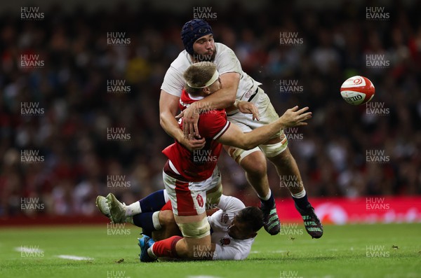 050823 - Wales v England, Vodafone Summer Series - Aaron Wainwright of Wales brushes off Danny Care of England as George Martin of England closes in