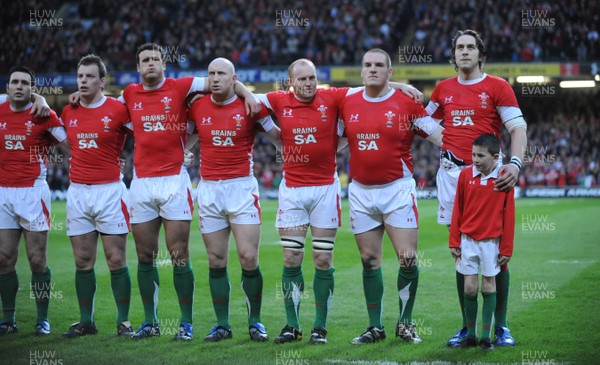 14.02.09 - Wales v England - RBS Six Nations 2009 - Wales players line up for the national anthems with match mascot Connor Stacey. 