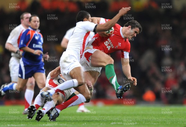 14.02.09 - Wales v England - RBS Six Nations 2009 - Wales' Jamie Roberts is tackled by England's Delon Armitage. 