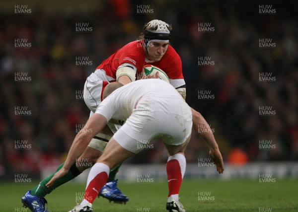 14.02.09  Wales v England... Wales' Ryan Jones takes on Mike Tindall. 