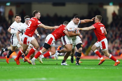 150325 - Wales v England - Guinness Six Nations - Ellis Genge of England is tackled by Elliot Dee and Gareth Anscombe of Wales 