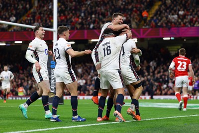 150325 - Wales v England - Guinness Six Nations - Henry Pollock of England celebrates with teammates after scoring his team's seventh try