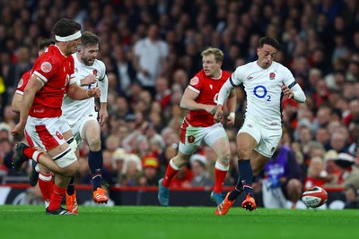 150325 - Wales v England - Guinness Six Nations - Alex Mitchell of England kicks the ball upfield ahead of scoring his team's sixth try