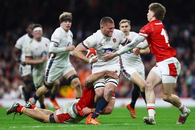 150325 - Wales v England - Guinness Six Nations - Tom Willis of England is tackled by Dafydd Jenkins and Ellis Mee of Wales