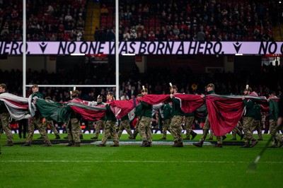 150325 - Wales v England - Guinness Six Nations - Soldiers prepare to unfurl the Welsh flag 