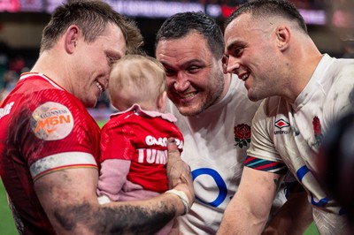 150325 - Wales v England - Guinness Six Nations - Nick Tompkins introduces his baby to Jamie George and Ben Earl