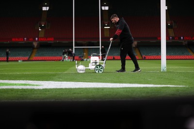 150325 - Wales v England - Guinness Six Nations Championship - Ground staff prepare the ground before the game