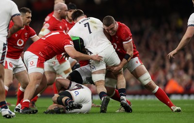 150325 - Wales v England - Guinness Six Nations Championship - Ben Curry of England is tackled by Nicky Smith and Will Rowlands of Wales 