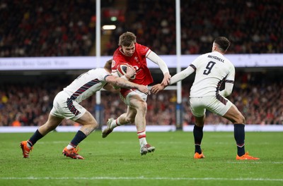 150325 - Wales v England - Guinness Six Nations Championship - Ellis Mee of Wales is tackled by Fin Smith and Alex Mitchell of England 