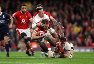 150325 - Wales v England - Guinness Six Nations Championship - Max Llewellyn of Wales is tackled by Alex Mitchell of England 