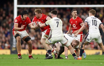 150325 - Wales v England - Guinness Six Nations Championship - Tommy Reffell of Wales is tackled by Ben Curry of England 