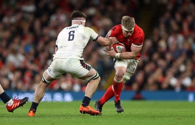 150325 - Wales v England - Guinness Six Nations Championship - Aaron Wainwright of Wales is tackled by Tom Curry of England 