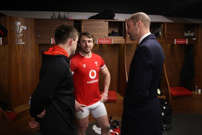 150325 - Wales v England - Guinness Six Nations Championship - Nick Tompkins and Rhodri Williams of Wales speak to HRH Prince William in the dressing room after the game