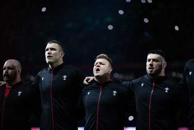 150325 - Wales v England - Guinness Six Nations Championship - Will Rowlands, Dewi Lake and Gareth Thomas of Wales sing the anthem