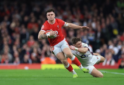 150325 Wales v England, Guinness Mens Six Nations - Joe Roberts of Wales is tackled by  Tommy Freeman of England