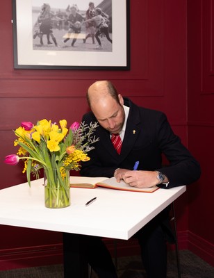 150325 Wales v England, Guinness Mens Six Nations - William, Prince of Wales signs the visitors book at the Principality Stadium after the Wales v England match