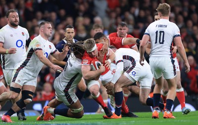 150325 Wales v England, Guinness Mens Six Nations - Aaron Wainwright of Wales is tackled