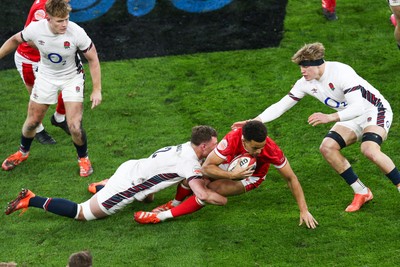 150325 - Wales v England - Guinness Six Nations - Ben Thomas of Wales is tackled by Fraser Dingwall of England