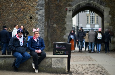 150325 - Wales v England - Guinness Six Nations - Fans make their way past Cardiff Castle ahead of kick off 